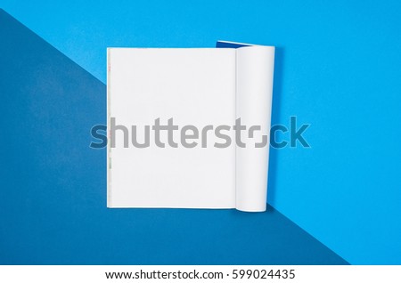 Mock-up magazine or catalog on colorful table. White page or notepad on modern background. Blank copy space for mockups or simulations.
