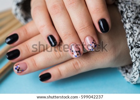 Women's hands with multi-colored pencils