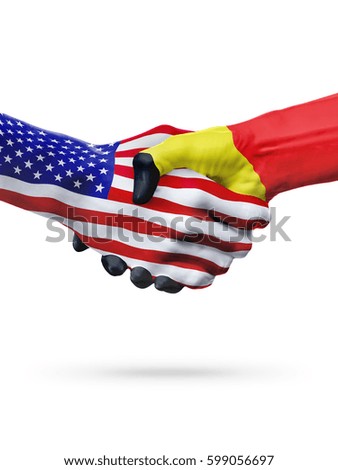 Flags United States and Belgium countries, handshake cooperation, partnership and friendship or sports competition isolated on white