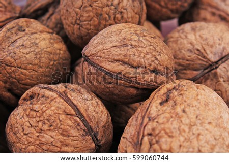

Walnut texture. Brown big walnuts as background. walnut nuts pattern close up photo.