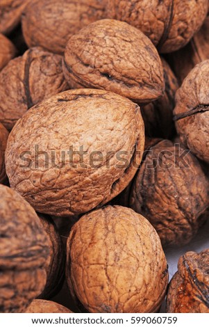 

Walnut texture. Brown big walnuts as background. walnut nuts pattern close up photo.