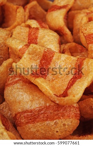 
Bacon flavored snacks. Bacon chips flips background pattern texture.