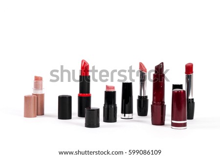 Set of lipsticks in various colors isolated on white background