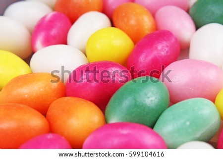 Easter candy. Egg shaped sugar candy for easter season. Easter celebration photo with colorful candy eggs.