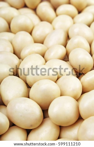 White chocolate balls. White chocolate as background texture pattern. 