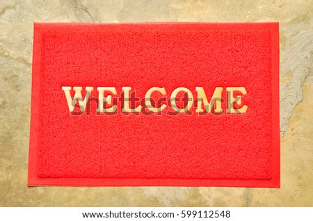 welcome mat in front of a door for entrancing into shop