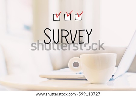 Survey concept with a cup of coffee and a laptop