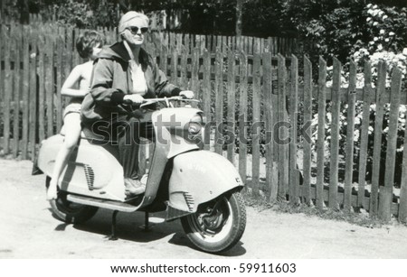 Vintage photo of mother and daughter on scooter (early sixties)