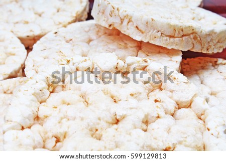 Stack of puffed whole grain crispbread. Rice cake puffed rice texture.Round rice cakes background. Corn crackers. Rice galettes Studio photo texture photography.

