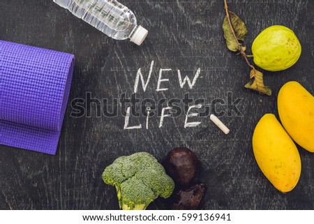 New life is written on chalk board. New life concept.