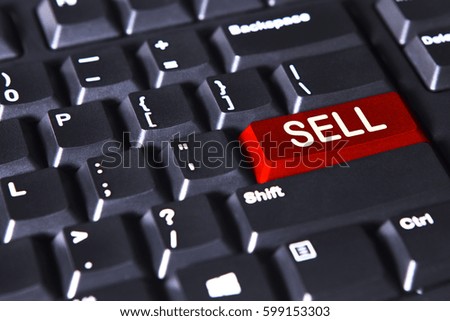 Image of computer keyboard with sell word on the red button