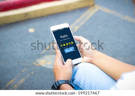 Hipster man hands holding smart phone Rate your experience