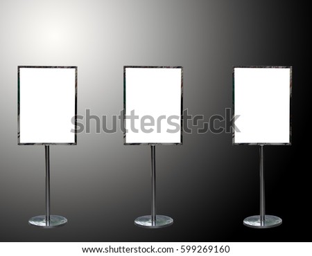 Three of blank mock up of poster billboards or white signboards on black color background and sof tlight
