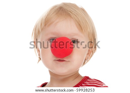 studio shot of child with clown nose