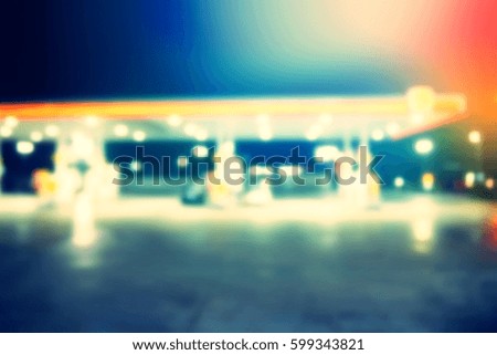 Blurred  background abstract and can be illustration to article of Petrol pump filling in night