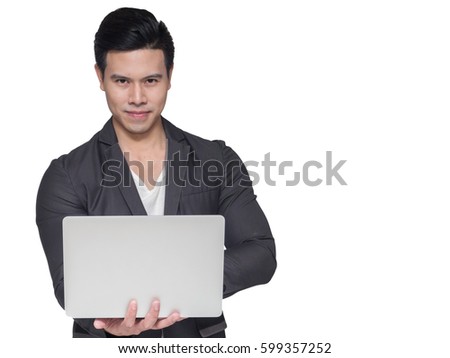 Young businessman in suit working on his laptop notebook isolated on white background
