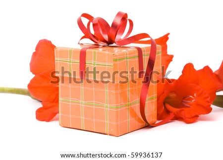 Beautiful gladiolus and gift box on a white background.