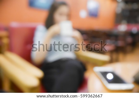 Picture blurred abstract background of asian woman drink coffee in coffee shop