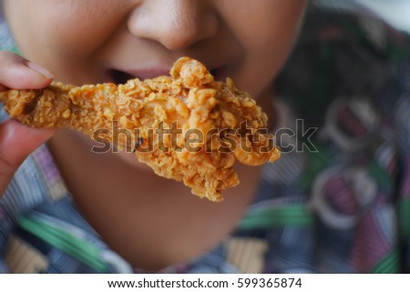 Picture blurred abstract background of table in fat woman eat fried chicken