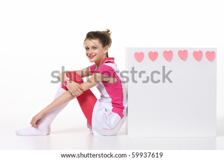 Lonely little girl sitting on white background. Teenage girl fall in love. Copy space. Happy Valentines Day!