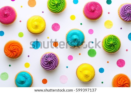 Colorful cupcakes on a white background Royalty-Free Stock Photo #599397137
