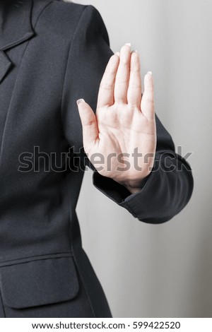 Serious businesswoman refusing to take bribe isolated on white. Corruption concept