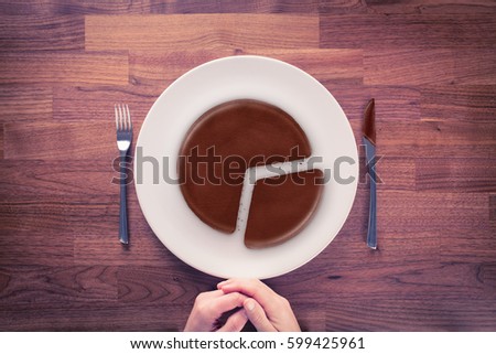 Market share - marketing business concept. Business visual metaphor - businessman with plate and pie chart with imitation of a chocolate cake.
