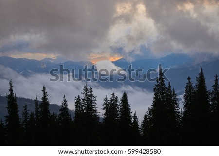 Storm clouds on sunrise mountain.