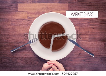 Market share - marketing business concept. Business visual metaphor - businessman with plate and pie chart with imitation of a chocolate cake and snippet with text Market Share.