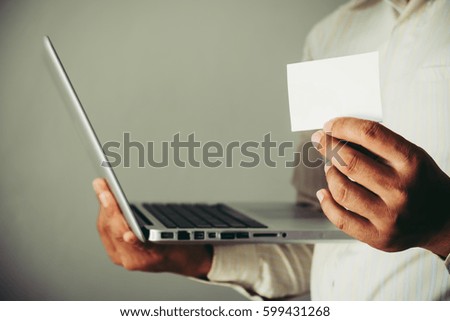 Business man holding business card