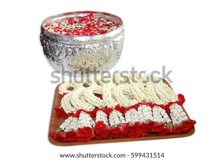 a group of Thai garland flowers and water with jasmine and roses corolla in bowl isolated on white background, use for Songkran festival in Thailand