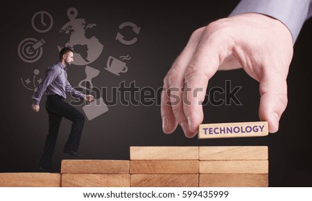 Business, Technology, Internet and network concept. Young businessman shows the word: Technology