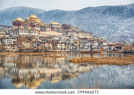 Songzanlin Temple also known as the Ganden Sumtseling Monastery, is a Tibetan Buddhist monastery in Zhongdian city( Shangri-La), Yunnan province China and is closely Potala Palace in Lhasa Royalty-Free Stock Photo #599466671