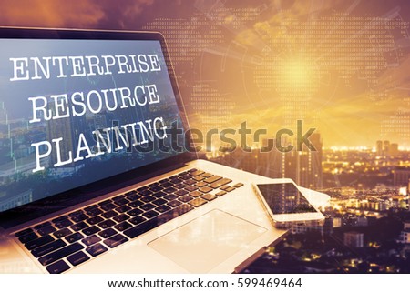 ERP (ENTERPRISE RESOURCE PLANNING): Grey screen laptop computer. Vintage effects. Digital Business and Technology Concept.