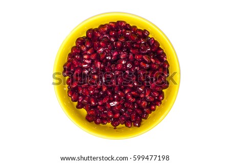 Top view of a bowl filled with pomegranate seeds. 