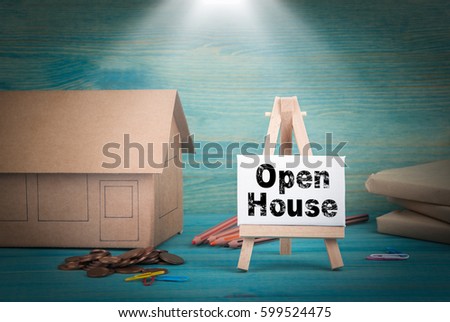 Open House. home model, money and a notice board under the sunlit