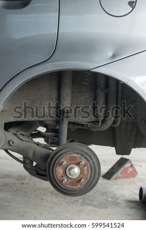 Car changing new tire lift up car by use hand jack.