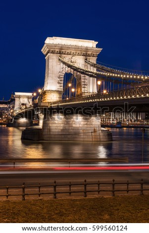Night view of Budapest, Chain bridge (Szechenyi lanchid) in city lights, famous tourist destination, vertical background Royalty-Free Stock Photo #599560124
