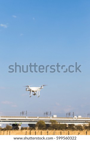 Drone fly in the blue sky