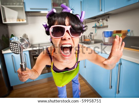 crazy housewife in an interior of the kitchen Royalty-Free Stock Photo #59958751
