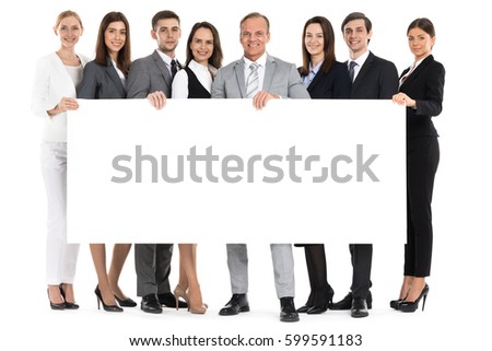 Full length portrait of business team holding blank billboard isolated on white background