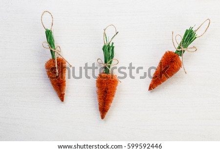 Fall autumn harvest spring easter orange carrots lying on white wooden table background with space for titles text