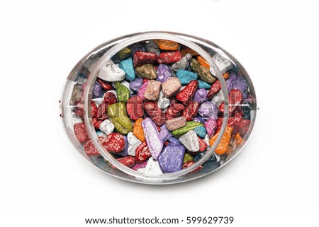 Multi-colored candies.Chocolates stones in a box