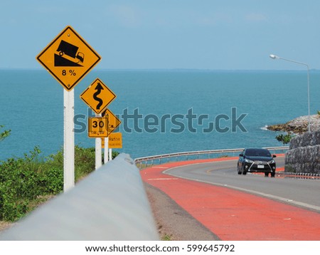 Traffic signs on seaside road.          