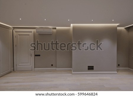Spacious room with white walls and light parquet, stock photo