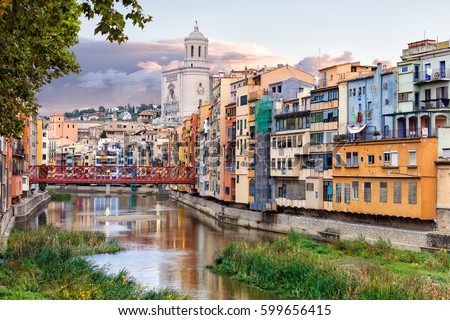 historical jewish quarter in Girona with Eiffel Bridge at sunrise, Barcelona, Spain, Catalonia Royalty-Free Stock Photo #599656415