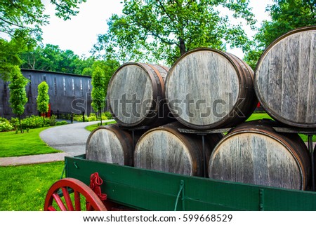Bourbon barrels on an antique wagon in Kentucky.  Royalty-Free Stock Photo #599668529