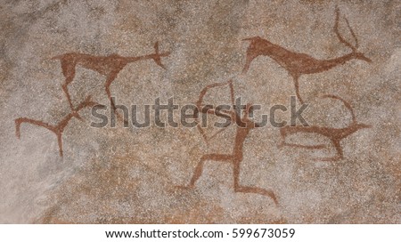 Drawing in a cave painted by an ancient man on a wall, a rock. Paints red ocher. Hunting for an animal., Neanderthal, cave man. The Stone Age, the Ice Age. Science, anthropology. Royalty-Free Stock Photo #599673059