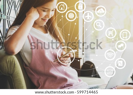 Woman use laptop with IOT, internet of things conceptual sign, internet era, internet in every day lifes