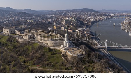 Aerial view of the Citadella and the Freedom Statue overlooking Budapest Royalty-Free Stock Photo #599717888